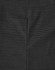 A close-up of a black pin dot patterned fabric, highlighting the texture and detail of the material.