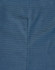 A close-up of a blue pin dot fabric, displaying subtle texture and stitching details typical of a long-sleeved button-up shirt.