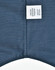 A button-up shirt featuring a pin dot pattern in navy blue, with a care label attached.