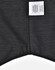 A black pin dot stretch short-sleeve shirt with a care label and a subtle pattern. Features a logo on the label.