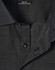 A close-up of a men's black pin dot stretch short-sleeve shirt featuring a slim fit and a collar with buttons.