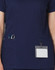A navy scrub top featuring contrast colour detailing, with pockets for tools and a name badge holder.