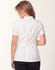 A short sleeve tunic in white, featuring a full zip front and a tailored back design. Includes a logo.