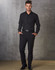 Men's black polyviscose stretch pants, styled with a matching shirt and belt, set against a textured grey background.