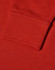 A close-up of a red long sleeve polo shirt, featuring a ribbed cuff and textured fabric.