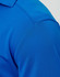 A close-up of a blue men's bamboo charcoal polo shirt, featuring a textured fabric and a collar.