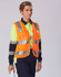 A safety polo shirt in bright yellow and navy with reflective stripes and a logo. A person is wearing it with a safety vest.