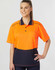 A woman models a bright orange and navy blue unisex polo shirt with a pocket and contrasting details.