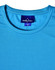 A light blue performance T-shirt with a crew neck and a logo on the label. The fabric appears breathable and smooth.