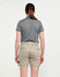 A pair of unisex cotton stretch drill work shorts in khaki, featured with a back view of a person wearing them.