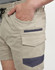 Work shorts in beige with dark navy accents, featuring pockets and an elastic waistband. The shorts have a logo.