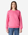 A pink Gildan Softstyle adult sweatshirt is worn by a model, paired with blue jeans. The sweatshirt has a logo.