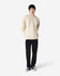 A cream-coloured Gildan Softstyle adult sweatshirt displayed on a model, paired with dark jeans and sneakers.