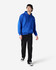 A blue adult hooded sweatshirt featuring a front pocket, worn by a model alongside black jeans and sneakers.