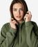 A model wearing a green Gildan Softstyle adult hooded sweatshirt, featuring a hood and drawstrings.