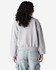 A women's crewneck sweatshirt in grey, featuring a relaxed fit and long sleeves, visible from the back.