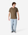 A unisex henley T-shirt in olive green, paired with light blue baggy jeans, displayed on a model.