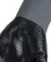 A close-up of a grey and black nitrile gripper glove, featuring textured grip and knitted wrist.