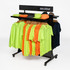 A display rack featuring orange and lime green garments, along with navy blue and brown hats. It has a branded logo.