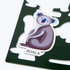 A custom die cut magnet sheet featuring a grey koala design on a dark green background, with a logo present.