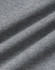 A close-up of grey fabric featuring a soft, textured surface, showcasing the CVC material of the crew neck sweater.