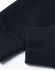 A close-up of a navy unisex crew neck sweater featuring ribbed cuffs and a smooth finish. Contains a logo.