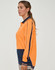 A woman models a bright orange long-sleeve polo shirt with navy accents and a logo.