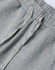 A close-up of grey unisex sweatpants with an elastic waistband and drawstring detail. The fabric appears soft and comfortable.