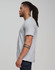 A grey men's premium cotton short sleeve tee shirt displayed on a model from the side, featuring a logo.
