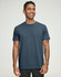 A navy blue men's premium cotton short sleeve t-shirt displayed on a smiling male model, featuring a logo.