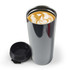 A drink bottle featuring a sleek, metallic design with a lid and a latte with intricate foam art visible inside.