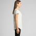 A light grey t-shirt featuring a relaxed fit and short sleeves, showcased from the side.