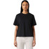 A black box tee featuring a relaxed fit and short sleeves, paired with light-coloured dress shorts.
