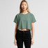 A cropped, green T-shirt with a relaxed fit, paired with black high-waisted jeans. The model stands in a neutral background.