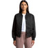 A black varsity bomber jacket with a snap button front, worn by a model. Features a logo on the chest.