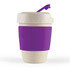 A reusable coffee cup in a beige color with a purple silicone band and lid. It features a logo.