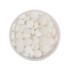 A round tin filled with small, round white mint candies.