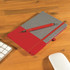 A Venture Bondi Notebook featuring a grey fabric cover with a red bottom half and a matching Austin Pen placed on top.