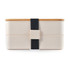 A beige eco lunch box with a bamboo lid and a black elastic band for secure closure. Features a logo.