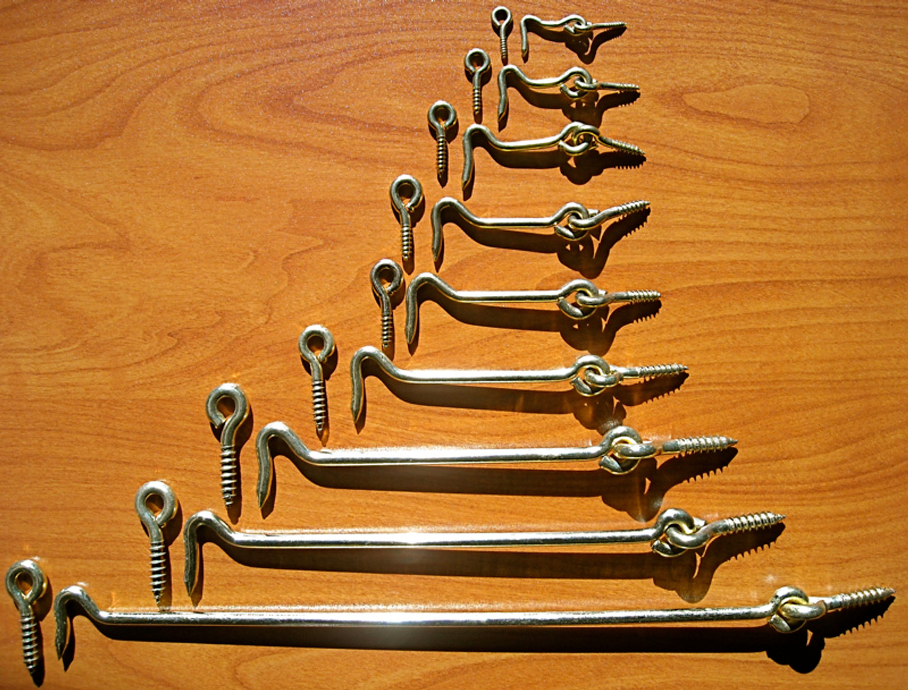 Pair of flat brass hooks and eyes