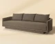 Gannon curved fabric sofa upholstered in Ernst Sandstone with a modern silhouette and fully upholstered base by Be Bold Furniture.