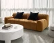 Romy tufted fabric sofa in Meg Gold with distressed brown solid beech wood legs and a contemporary upholstered design by Be Bold Furniture.