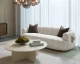 Tadeo Sofa in Dove Cream fabric with a warm brown solid oak base, antique brass accents, and a modern sculptural design by Be Bold Furniture.