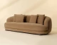 Valentina sofa upholstered in Kona Camel fabric with a gently curved frame, four back cushions, and espresso rubberwood feet by Be Bold Furniture.