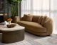 Valentina sofa upholstered in Kona Camel fabric with a gently curved frame, four back cushions, and espresso rubberwood feet by Be Bold Furniture.