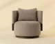 Bastille swivel lounge chair upholstered in Rhine Sandbank fabric with a chiselled solid oak backrest and 360-degree swivel base by Be Bold Furniture.