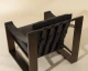 Berke lounge chair in charcoal black top grain buffalo leather with an antique bronze iron frame and leather strap detailing by Be Bold Furniture.