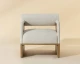 Coburn lounge chair upholstered in Sahara Sand semi-aniline leather with rustic oak wood legs and a bolster back by Be Bold Furniture.