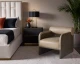 Coburn lounge chair upholstered in Sahara Sand semi-aniline leather with rustic oak wood legs and a bolster back by Be Bold Furniture.
