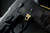 Sig Sauer P320 AXG Magazine Release Kit shown mounted on a handgun